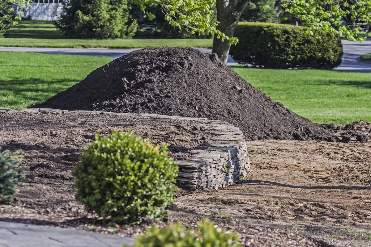 Topsoil, a heavier soil mixed with sandy loam to create a perfect blend of soil for installing sod, re-levelling and grading your property.